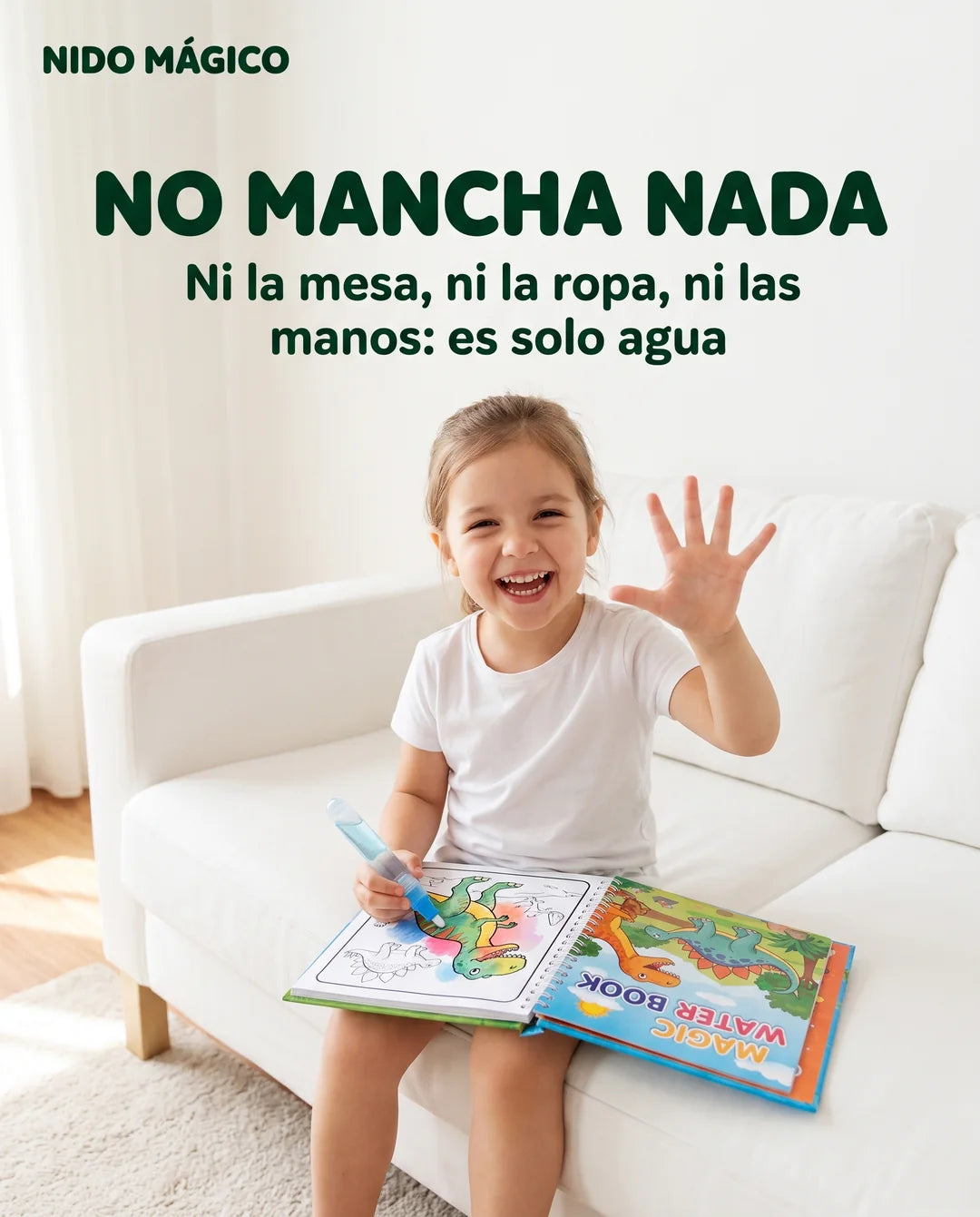Niña con camiseta blanca pintando el Libro Mágico en un sofá blanco sin mancharse